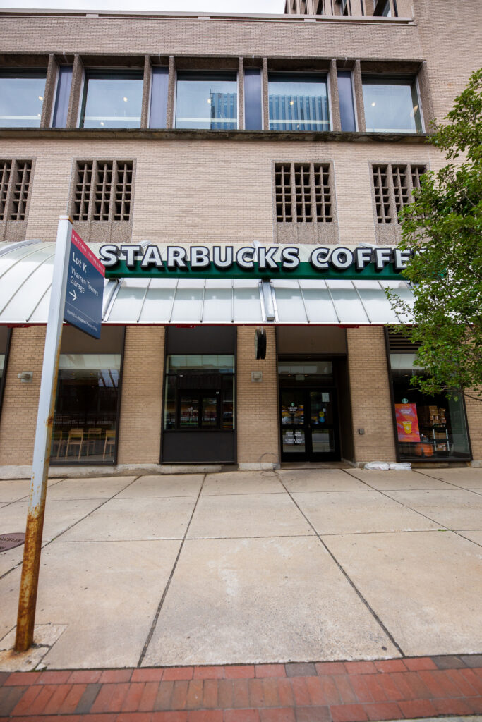 Front entrance to a Starbucks in a brick building