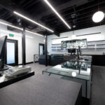 Cannabis retail area with glass cases and a register.