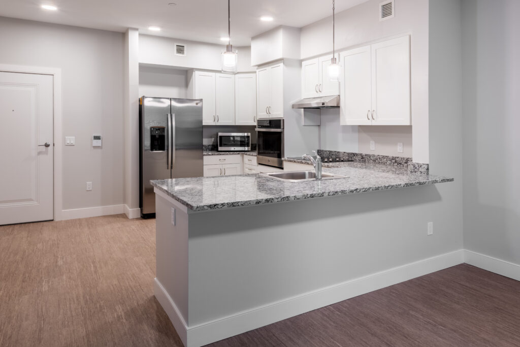 Open floor plan kitchen with granite counter tops.